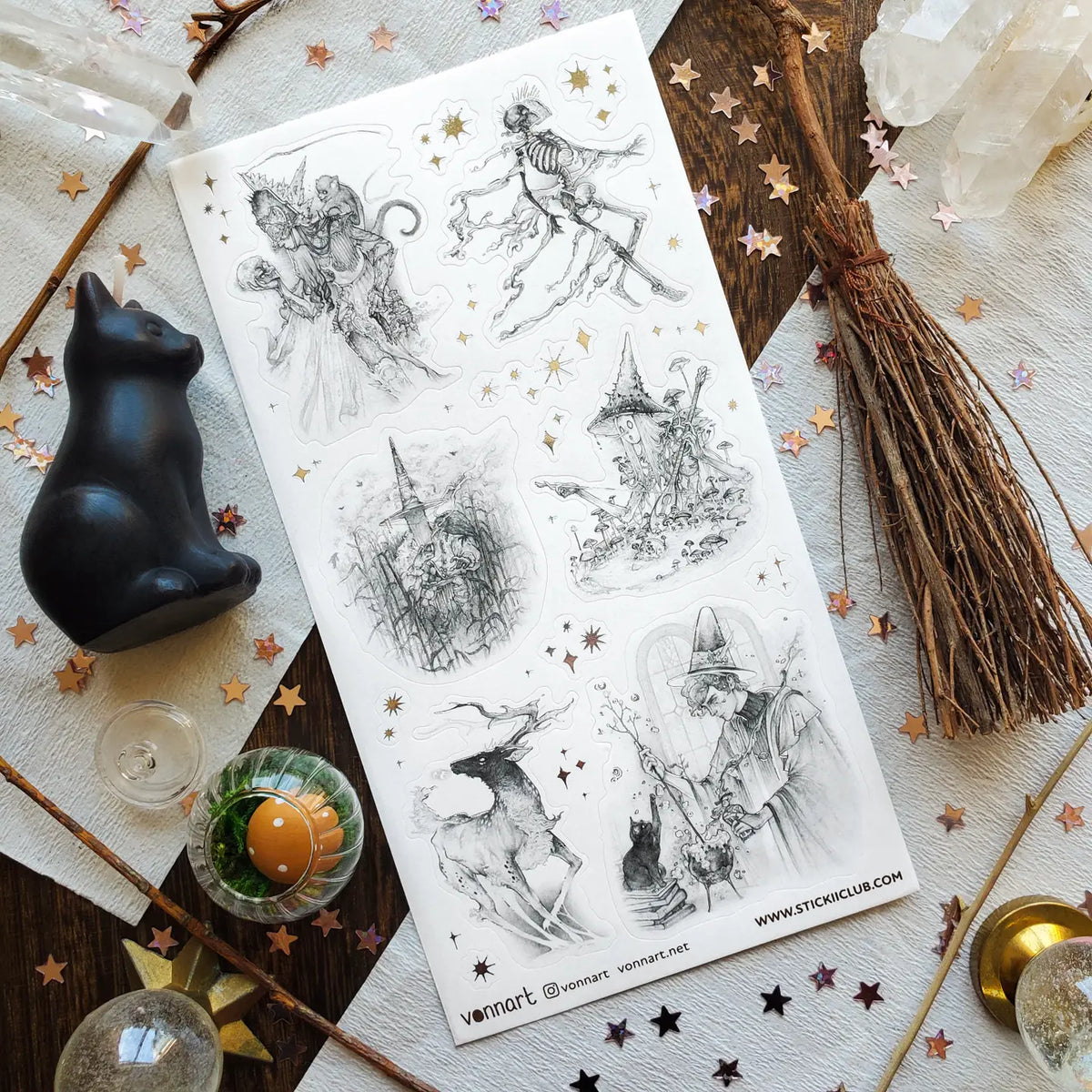Step into @vonnart’s spellbound woodland, where stars glitter overhead and the forest keeps its secrets well. A crowned figure cloaked in bones, towering mushrooms, witchy alchemy, and an otherworldly stag emerge like fragments of a dark fairytale. Haunting, whimsical, and beautifully imaginative, it will bring a touch of forest magic to your pages.
Art by: @vonnart
One sticker sheet is included.
Top Coating: Silver foil
Adhesive Layer: Paper
Backing Layer: Paper
Size: 6.69"x3.54"
Weight-0.03oz