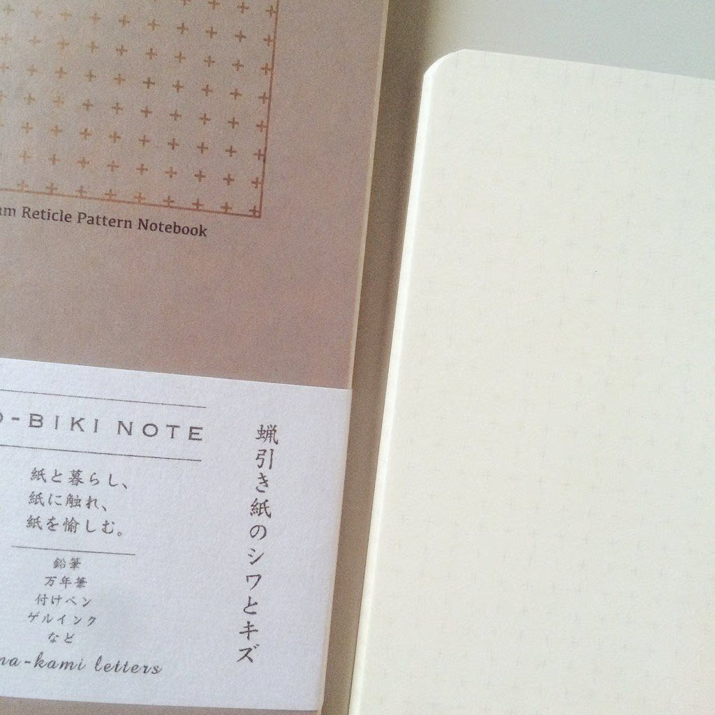 The RO‑BIKI Note is a beautifully crafted Japanese notebook known for its distinctive waxed paper cover, which gains character the more you use it. Over time, the cover softens, develops a natural patina, and becomes uniquely yours—making every notebook feel personal and well‑loved.
Inside, you’ll find high‑quality 5mm reticle pattern paper ideal for writing, sketching, planning, or journaling. Its compact size makes it perfect for everyday carry, while the durable construction ensures it holds up to frequ