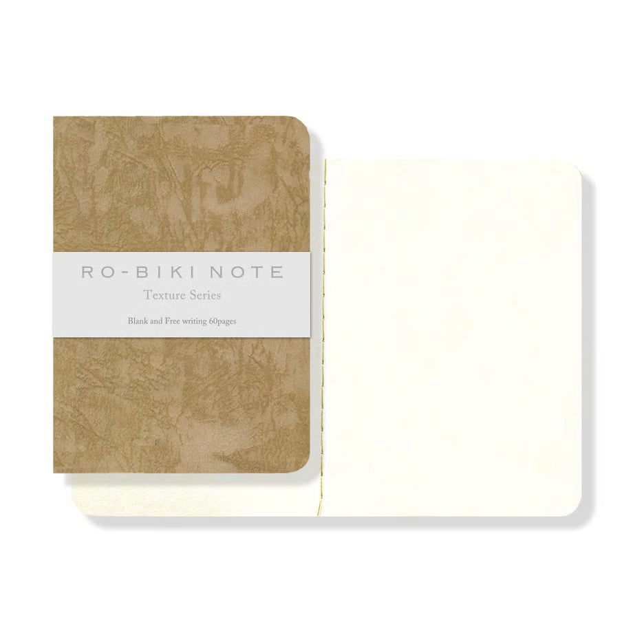 The RO‑BIKI Note is a beautifully crafted Japanese notebook known for its distinctive waxed paper cover, which gains character the more you use it. Over time, the cover softens, develops a natural patina, and becomes uniquely yours—making every notebook feel personal and well‑loved.