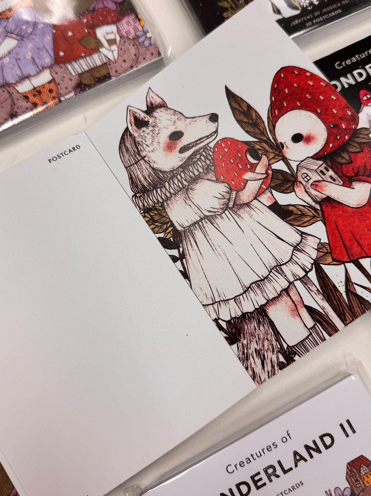 jb0xtchi Postcard Set - Creatures of Wonderland 2
The Creatures of Wonderland 2 Postcard Set includes 20 postcards featuring artwork illustrated by jb0xtchi (Jessica Ng). jb0xtchi creates stationary and small trinkets from whimsical ideas in the form of painting using ink, watercolor, and gouache.
6in x 4in postcards
20 different designs
All artwork done by Jessica Ng