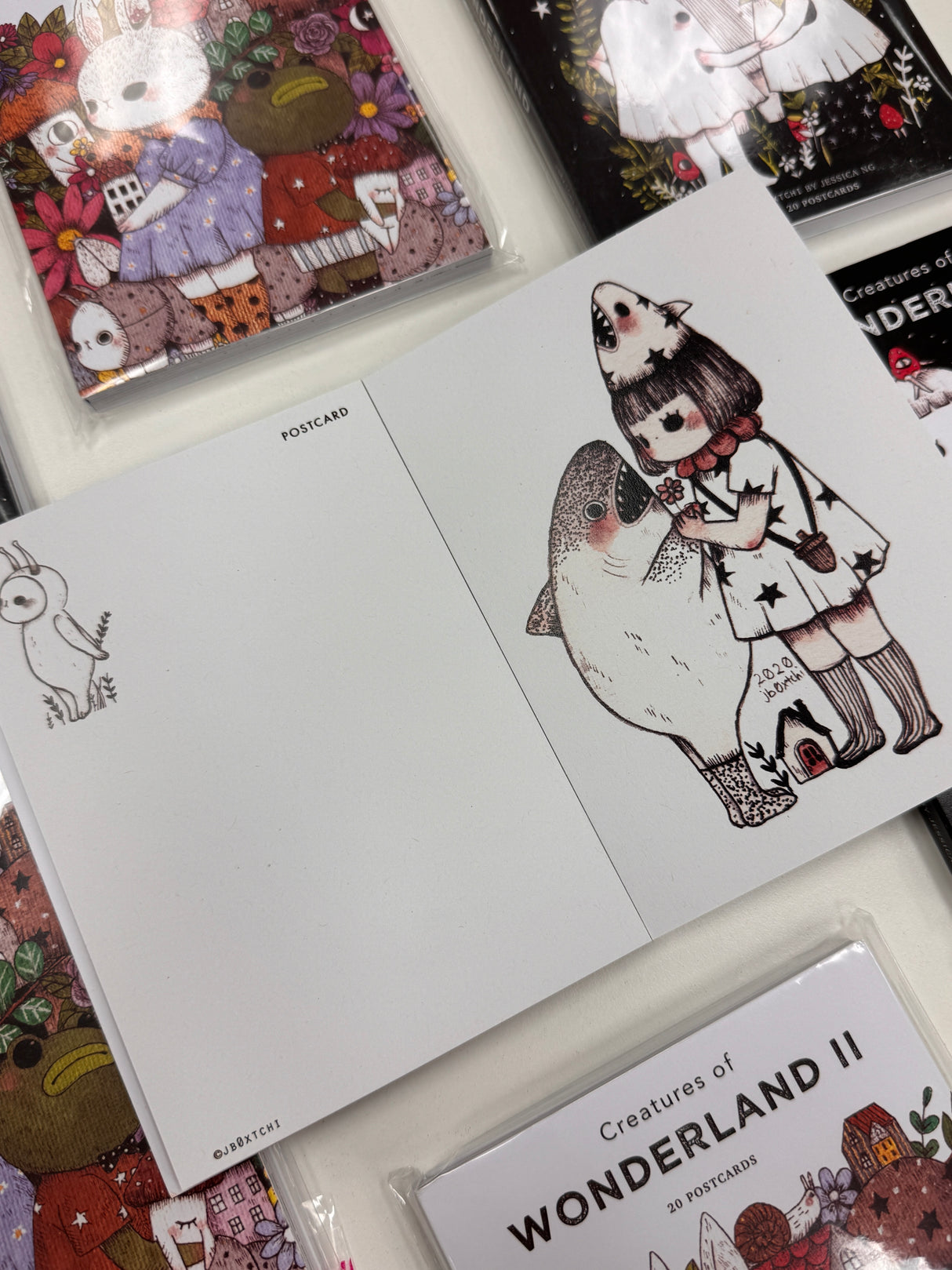 jb0xtchi Postcard Set - Creatures of Wonderland 2
The Creatures of Wonderland 2 Postcard Set includes 20 postcards featuring artwork illustrated by jb0xtchi (Jessica Ng). jb0xtchi creates stationary and small trinkets from whimsical ideas in the form of painting using ink, watercolor, and gouache.
6in x 4in postcards
20 different designs
All artwork done by Jessica Ng