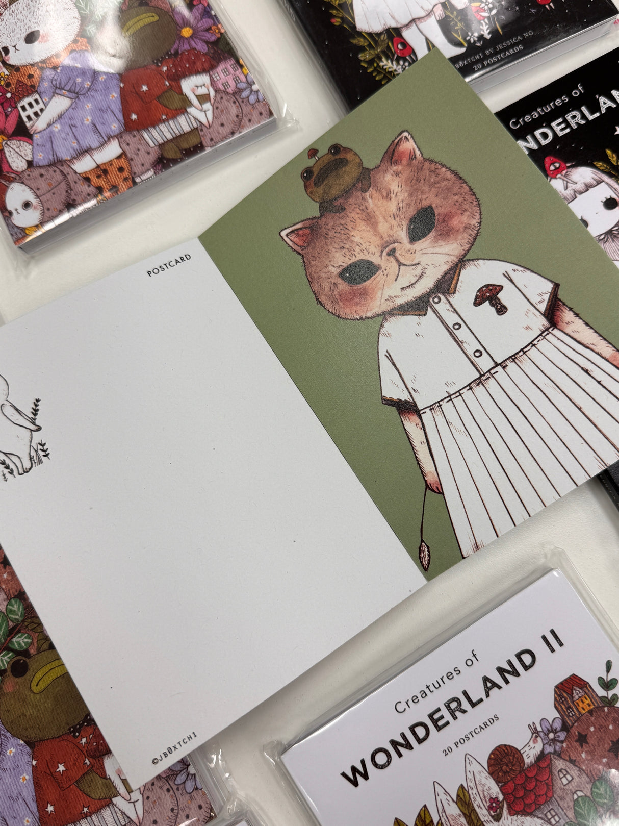 jb0xtchi Postcard Set - Creatures of Wonderland 2
The Creatures of Wonderland 2 Postcard Set includes 20 postcards featuring artwork illustrated by jb0xtchi (Jessica Ng). jb0xtchi creates stationary and small trinkets from whimsical ideas in the form of painting using ink, watercolor, and gouache.
6in x 4in postcards
20 different designs
All artwork done by Jessica Ng