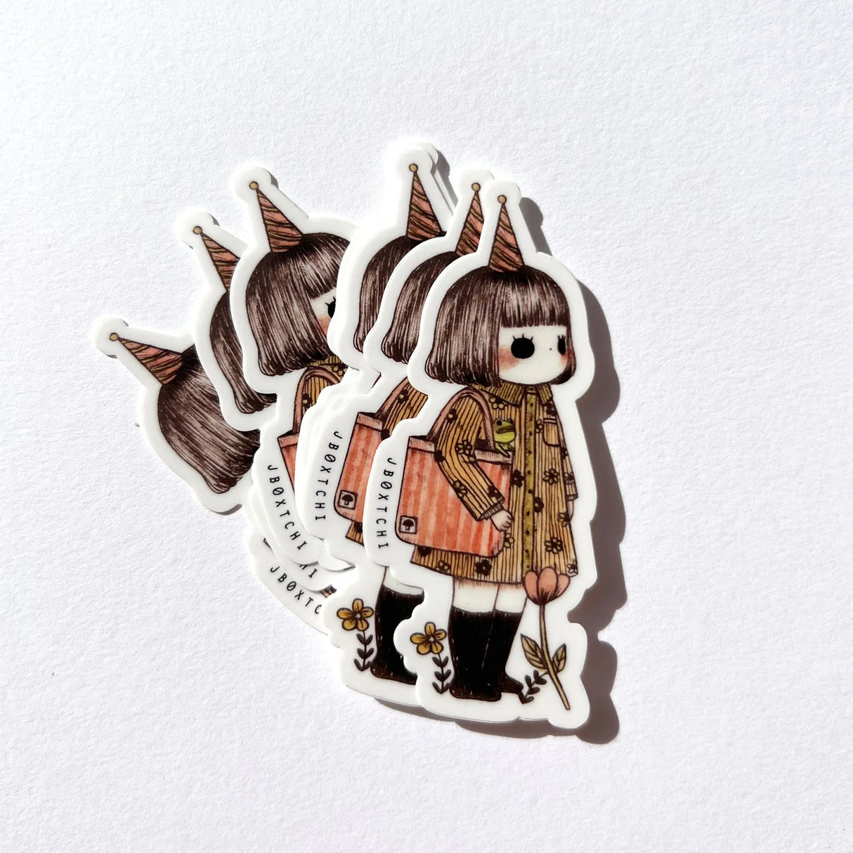 jb0xtchi Vinyl Sticker - Little Girl
The little girl vinyl sticker was illustrated by jb0xtchi (Jessica Ng). jb0xtchi creates stationary and small trinkets from whimsical ideas in the form of painting using ink, watercolour, and gouache.