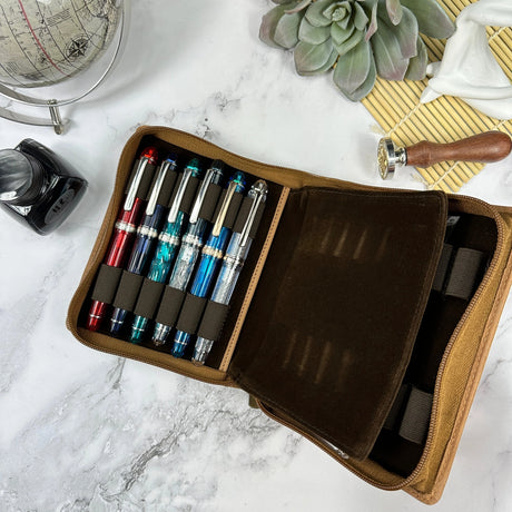 Indulge in the epitome of elegance with the Girologio 12 Zippered Pen Case. Meticulously crafted from premium, eco-friendly tanned leather, this zippered case promises a lavish velvet interior and generous space to securely accommodate up to 12 pens. Girologio once again emerges as a superior choice for safeguarding your cherished writing instruments, seamlessly combining plush softness and flexibility with unparalleled toughness and durability.