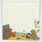 Illustration of two bears at a campsite with mountains in the background