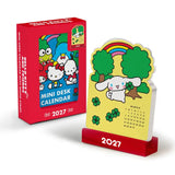 Say hello to the new year with this adorable Hello Kitty® and Friends Mini Desk Calendar (Jan.–Dec. 2027). Each month is printed on a sturdy, die-cut card featuring a different Sanrio character paired with colorful seasonal artwork. Place the current month on the included wooden stand for a sweet, simple, space-saving calendar reference you’ll enjoy all year long!

• Box: 3.75"w x 5.25"h 
• 12 months (Jan.–Dec. 2027) 
• 13 sheets; 300 gsm acid-free, FSC®-certified paper 
• Includes sturdy wood stand 

© 202