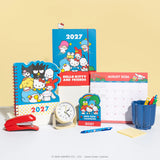 Say hello to the new year with this adorable Hello Kitty® and Friends Mini Desk Calendar (Jan.–Dec. 2027). Each month is printed on a sturdy, die-cut card featuring a different Sanrio character paired with colorful seasonal artwork. Place the current month on the included wooden stand for a sweet, simple, space-saving calendar reference you’ll enjoy all year long!

• Box: 3.75"w x 5.25"h 
• 12 months (Jan.–Dec. 2027) 
• 13 sheets; 300 gsm acid-free, FSC®-certified paper 
• Includes sturdy wood stand 

© 202