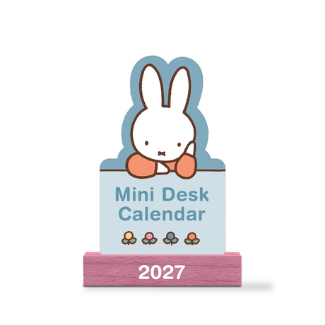 Welcome the new year with this adorable Miffy Desk Calendar (Jan.–Dec. 2027). Each month is printed on a sturdy, die-cut card featuring the iconic bunny in pastel colors and seasonal artwork. Place the current month on the included wooden stand for a sweet, simple calendar reference you’ll enjoy all year long.

• Box: 3.75"w x 5.25"h 
• 12 months (Jan.–Dec. 2027) 
• 13 sheets; 300 gsm acid-free, FSC®-certified paper 
• Shrink-wrapped in paper box 
• Includes sturdy wood stand 

© Mercis bv