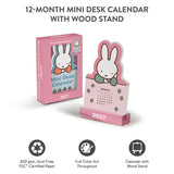 Welcome the new year with this adorable Miffy Desk Calendar (Jan.–Dec. 2027). Each month is printed on a sturdy, die-cut card featuring the iconic bunny in pastel colors and seasonal artwork. Place the current month on the included wooden stand for a sweet, simple calendar reference you’ll enjoy all year long.

• Box: 3.75"w x 5.25"h 
• 12 months (Jan.–Dec. 2027) 
• 13 sheets; 300 gsm acid-free, FSC®-certified paper 
• Shrink-wrapped in paper box 
• Includes sturdy wood stand 

© Mercis bv