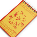 A nostalgic nod to the stationery aisle—those tiny spiral notebooks you’d flip through while your mom checked out at the local five-and-dime. These vintage-style memo pads are straight out of the 1980s, reimagined with photo-real backgrounds and everyone’s favorite beagle doing what he does best: being adorable.
