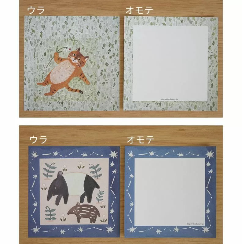 Two sets of stationery items with cat and bear illustrations on a wooden surface.