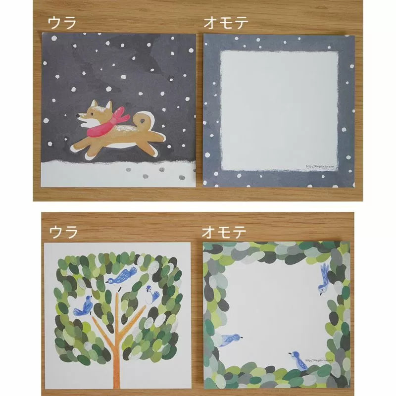 Two sets of illustrated cards with dog and tree designs on a wooden background.