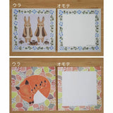 Two sets of stationery with animal illustrations on a wooden background