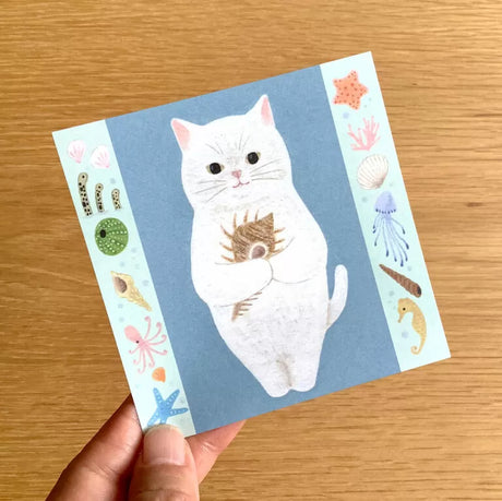 4legs Cat Memo - New #3 Shiro-Neko

Featuring charming watercolor of a cat holding a shell from Japanese illustrator 4legs

It is a convenient size that is not too big or too small.&nbsp;Please use it&nbsp;as a communication tool for small thank you and announcements.&nbsp;There are no lines on the front side, so&nbsp;you can use it freely as&nbsp;a shop card or business card&nbsp;with stamps and stickers&nbsp;as well as memos and letters.&nbsp;It is a great gift for people who like paper.&nbsp;The gorgeous