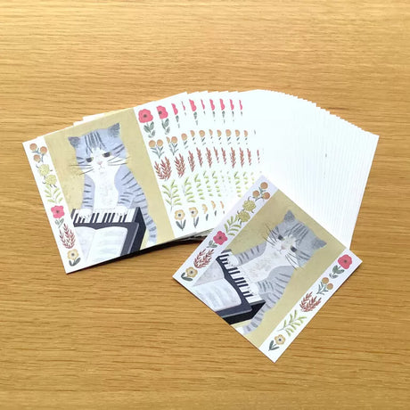 Featuring charming watercolor of a cat from Japanese illustrator 4legs

It is a convenient size that is not too big or too small.&nbsp;Please use it&nbsp;as a communication tool for small thank you and announcements.&nbsp;There are no lines on the front side, so&nbsp;you can use it freely as&nbsp;a shop card or business card&nbsp;with stamps and stickers&nbsp;as well as memos and letters.&nbsp;It is a great gift for people who like paper.&nbsp;The gorgeous and gentle designs&nbsp;will make you feel warm and