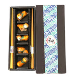 5 Pair Bamboo Chopsticks and Shiba Porcelain Chopsticks Rest Gift Set. This Chopstick and Rest Gift Set Comes 5 Pair Bamboo Chopsticks with 5 piece assorted cats chopsticks rest in gift box packaging. Chopstick Rests are Dishwasher Safe. Gorgeous Box, Perfect Asian Gift for Holidays and any Occasion.

Size: 9 inch chopsticks, 2.25 inches W chopsticks rest
Material: Bamboo and Ceramic
Origin: China