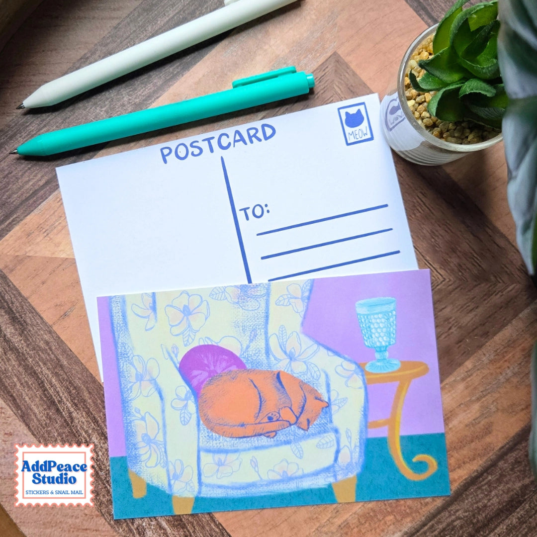 AddPeace Studio - Cats &amp; Cups Postcard Pack

A charming illustrated postcard set for cat lovers, homebodies, and anyone craving a little analog joy. This Cats &amp; Cups postcard pack celebrates quiet moments, warm drinks, and the simple pleasure of sending real mail. Designed for the current resurgence of snail mail, pen pals, and intentional connection, these postcards make it easy (and fun) to go offline on purpose.

Each set includes ten unique 4x6 postcards featuring original Cats &amp; Cups illust
