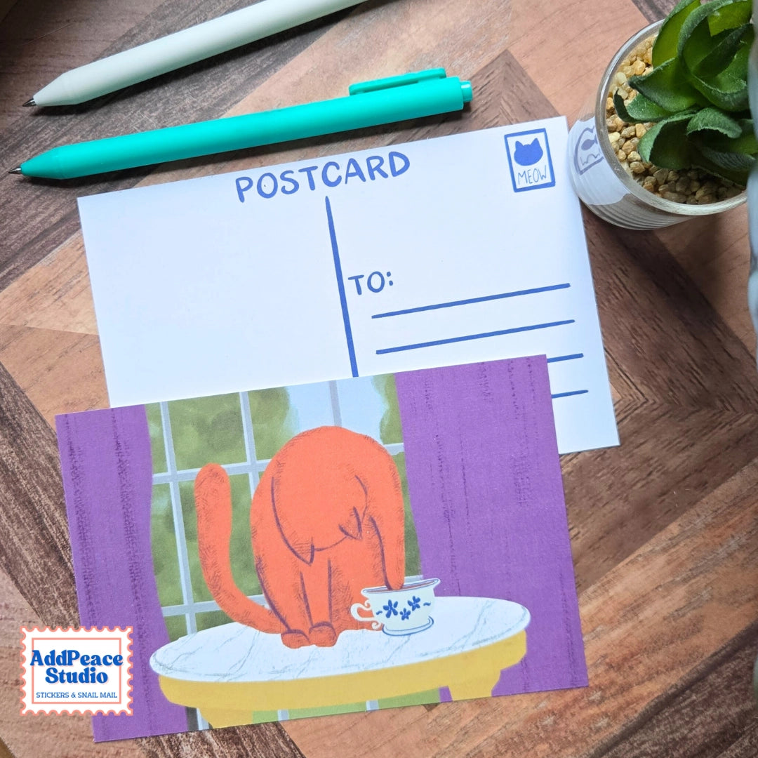 AddPeace Studio - Cats &amp; Cups Postcard Pack

A charming illustrated postcard set for cat lovers, homebodies, and anyone craving a little analog joy. This Cats &amp; Cups postcard pack celebrates quiet moments, warm drinks, and the simple pleasure of sending real mail. Designed for the current resurgence of snail mail, pen pals, and intentional connection, these postcards make it easy (and fun) to go offline on purpose.

Each set includes ten unique 4x6 postcards featuring original Cats &amp; Cups illust