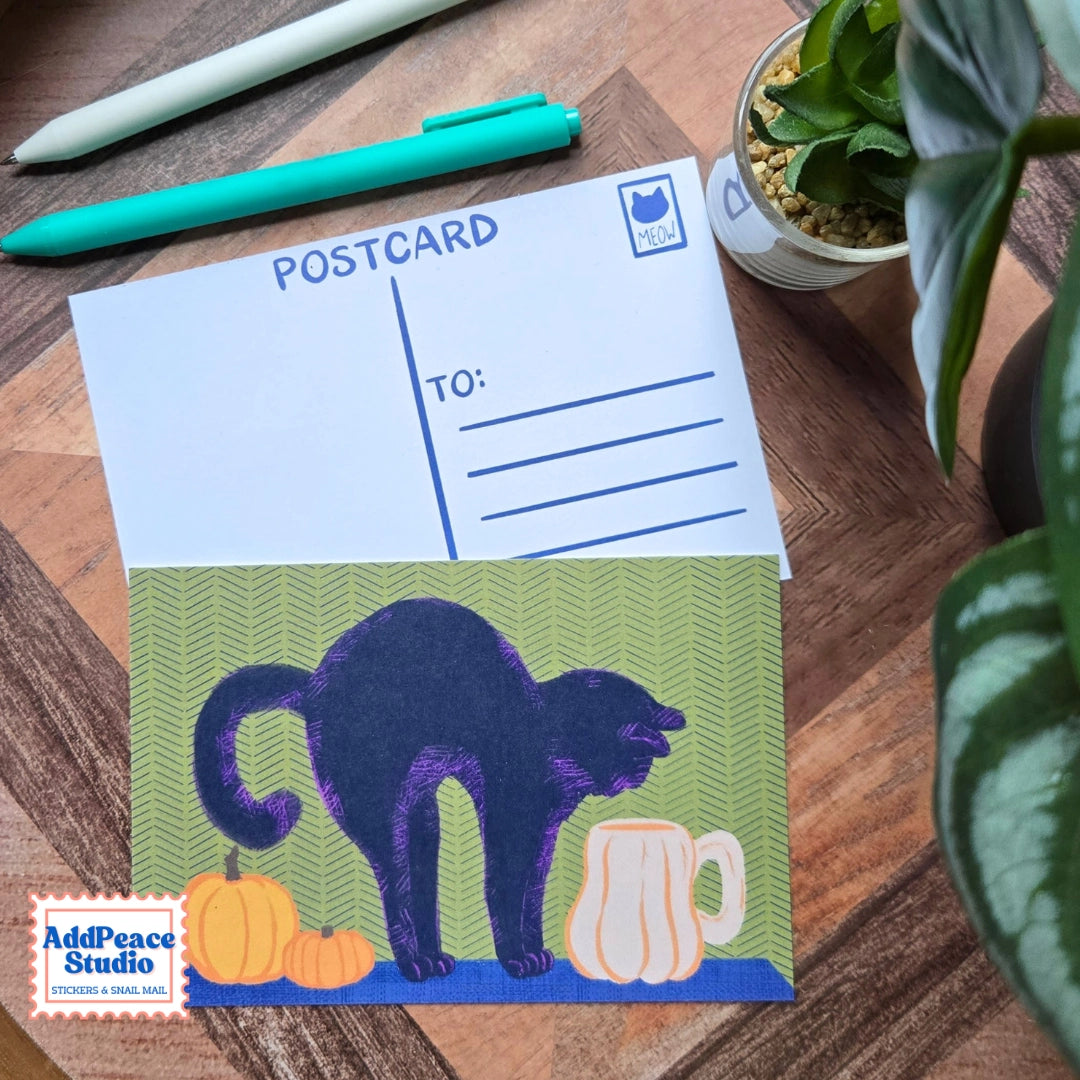 AddPeace Studio - Cats &amp; Cups Postcard Pack

A charming illustrated postcard set for cat lovers, homebodies, and anyone craving a little analog joy. This Cats &amp; Cups postcard pack celebrates quiet moments, warm drinks, and the simple pleasure of sending real mail. Designed for the current resurgence of snail mail, pen pals, and intentional connection, these postcards make it easy (and fun) to go offline on purpose.

Each set includes ten unique 4x6 postcards featuring original Cats &amp; Cups illust