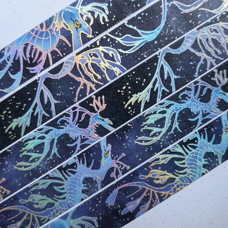 AdrianSlothArt - Leafy Sea Dragon Holographic Foil Washi Tape

Washi tape with holographic foil highlighting the outlines of the leafy sea dragon. Inspired by leafy sea dragons which are similar to seahorses but they have a more ethereal appearance.

Details:

15 mm x 10 m
holographic foil washi tape