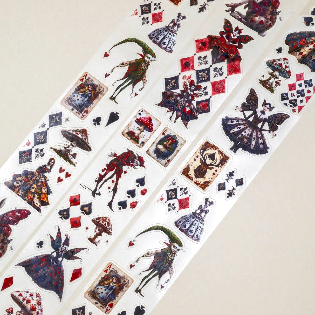 Step into the world of Alice's Wonderland with this unique transparent PET tape by CoraCreaCrafts. Designed with an intricate mix of dark Wonderland-inspired stickers and vintage Queen of Hearts styles. This tape is 5cm wide with a 100cm repeat loop making it 5m long, precut designs (like stickers), showcasing a variety of detailed designs.
The glossy finish adds a sophisticated shine, making it perfect for adding a touch of moody charm to your creative projects.