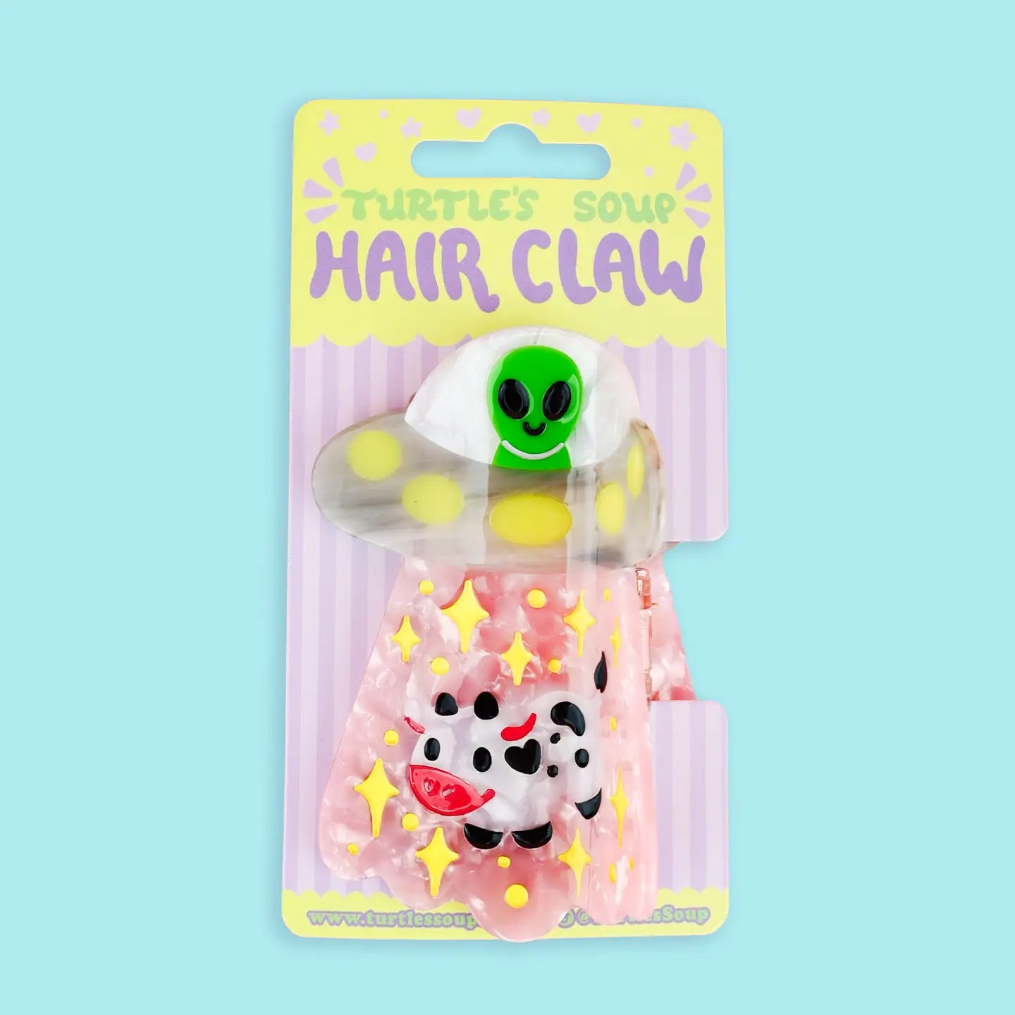 Alien UFO Hair Claw' Hair Accessory by Turtle's Soup.

Includes one (1) hair claw
Claw is roughly 3"
3D, engraved, printed, and painted details
High quality acetate material, stronger than standard hair clips
Themed packaging