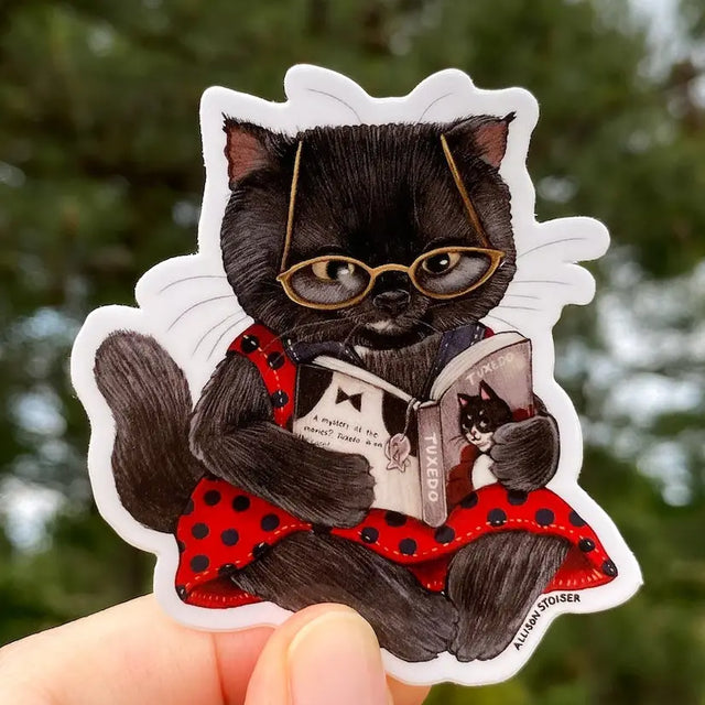 A mystery at the movies? This little black cat can't wait to see how Tuxedo, the famed feline detective, cracks this case!


This 2.5" die-cut gloss vinyl sticker is durable, weatherproof, and perfect for water bottles, notebooks, laptops, bikes, and all sorts of other surfaces! Make sure to clean and dry the surface thoroughly before applying.