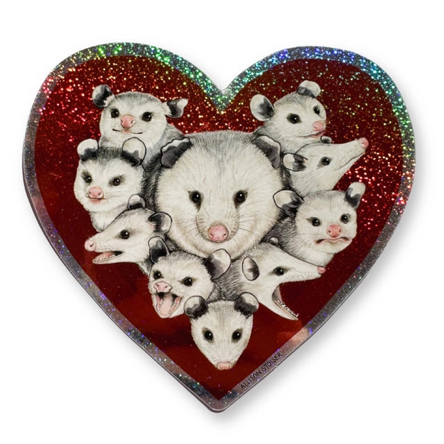 This heart-shaped glittery weatherproof sticker features my illustration of a mom opossum surrounded by her babies.

This die-cut gloss 4” vinyl sticker is durable, weatherproof, and perfect for water bottles, notebooks, laptops, bikes, and all sorts of other surfaces! Make sure to clean and dry the surface thoroughly before applying.