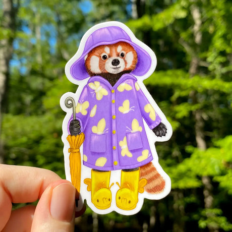 This weatherproof vinyl sticker features my illustration of a red panda dressed up in a butterfly raincoat. Her caterpillar boots and coordinating yellow umbrella complete the ensemble!