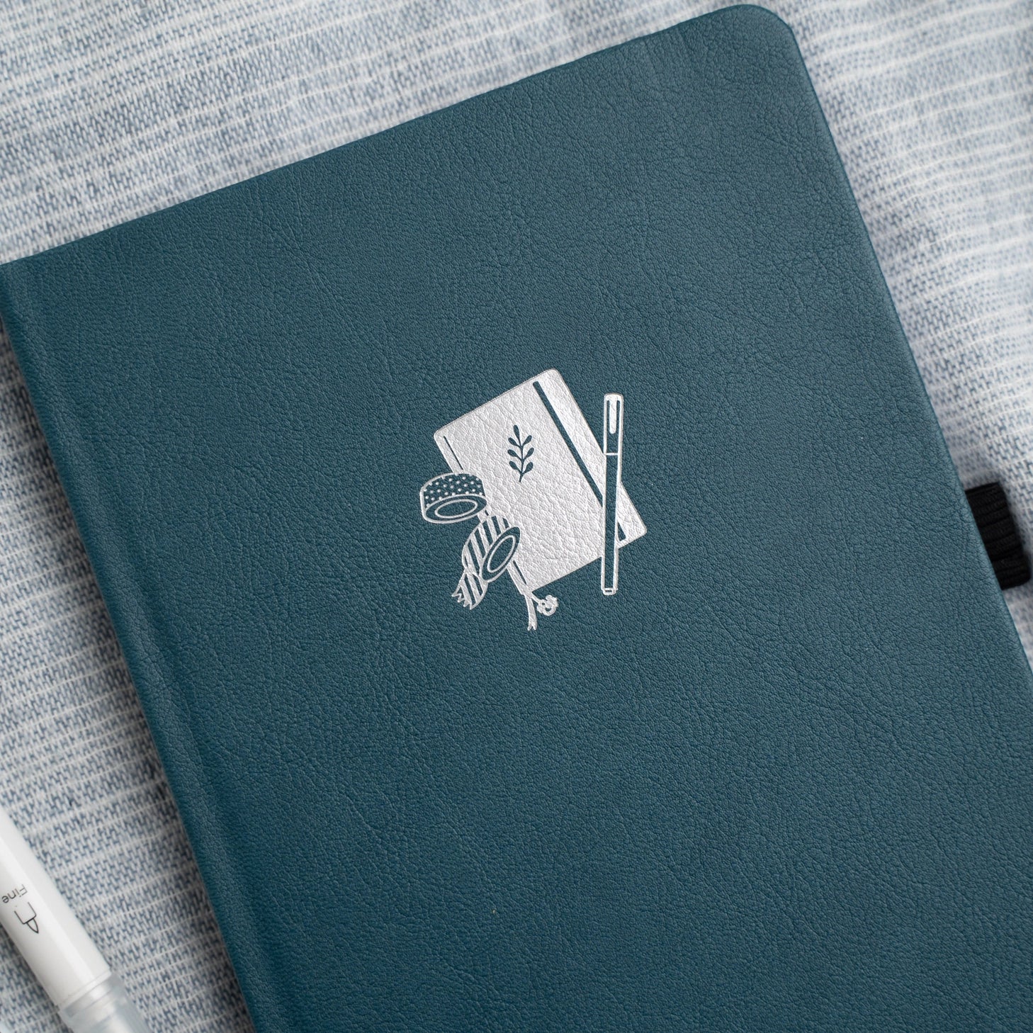 Archer and Olive presents the A5 Doorbuster - Superfan, a stationery essential for journaling enthusiasts. Our journal/diary is a trusted companion for those who value mental wellness and express creativity. This A5-sized journal features our iconic design, providing a perfect space for your thoughts, plans, and ideas. It is a must-have for anyone who appreciates the art of writing. Whether you're a seasoned journaler or just starting your journey, our A5 Doorbuster - Superfan journal is your perfect partne