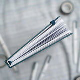 Archer and Olive presents the A5 Doorbuster - Superfan, a stationery essential for journaling enthusiasts. Our journal/diary is a trusted companion for those who value mental wellness and express creativity. This A5-sized journal features our iconic design, providing a perfect space for your thoughts, plans, and ideas. It is a must-have for anyone who appreciates the art of writing. Whether you're a seasoned journaler or just starting your journey, our A5 Doorbuster - Superfan journal is your perfect partne