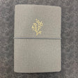 A beautifully curated B6 softcover notebook set designed for everyday creativity and planning. This set includes a grey soft notebook cover with three insert bands and three coordinating notebooks: one white dot‑grid notebook, one white grid notebook and one white lined notebook, each featuring 40 pages of thick 160gsm paper—perfect for journaling, sketching, note‑taking, and bullet planning.

Thoughtfully crafted by Archer &amp; Olive, this bundle gives you a flexible, customizable writing system you can c