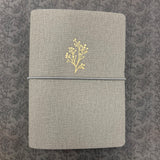 A beautifully curated B6 softcover notebook set designed for everyday creativity and planning. This set includes a grey soft notebook cover with three insert bands and three coordinating notebooks: one white dot‑grid notebook, one white grid notebook and one white lined notebook, each featuring 40 pages of thick 160gsm paper—perfect for journaling, sketching, note‑taking, and bullet planning.

Thoughtfully crafted by Archer &amp; Olive, this bundle gives you a flexible, customizable writing system you can c