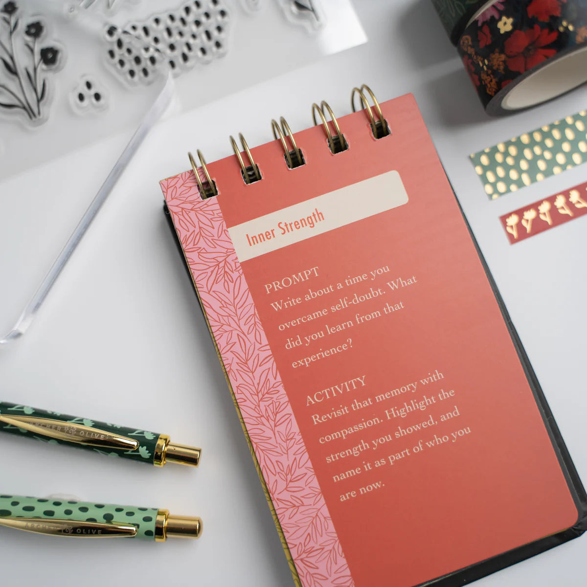Nurture your creativity with the Flourish Self Care Box, a beautifully curated collection designed with mental wellness in mind. Designed with intention, this box brings together everything you need to begin (or return to) a meaningful creative practice.

Inside you will find: 

A5 Bloom & Grow Notebook: featuring a full cover printed abstract floral design, hand stamped with gold foil accents on a vegan leather cover.

Writing Set: including a 0.5mm Ballpoint Pen and Mechanical Pencil with Eraser, both emb