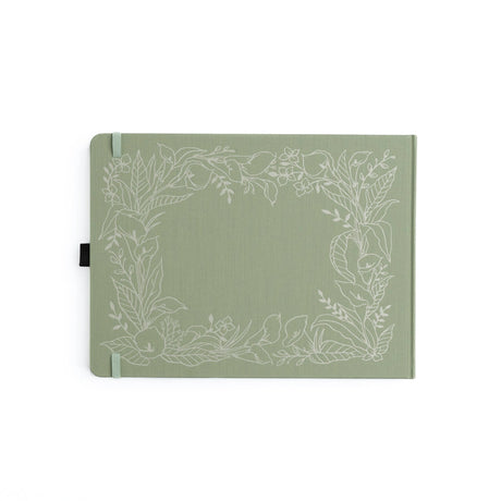 Introducing the&nbsp;Lovely Lilies Heirloom&nbsp;notebook.&nbsp;This&nbsp;Letter Sized&nbsp;notebook features&nbsp;a full-cover&nbsp;floral border design, stamped in&nbsp;white&nbsp;on a&nbsp;sage green buckram&nbsp;cover. The design spans the entire notebook, with special details on the back cover, spine, and front cover.



Designed with&nbsp;lined pages, this journal provides a structured space for thoughtful reflections, personal writing, note-taking, or planning. Whether you're using it as a memory-kee
