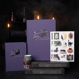 The Bewitched Notebook captures the playful spirit of Halloween with a charming black cat perched atop a broomstick beneath a crescent moon, surrounded by twinkling stars and fluttering bats.