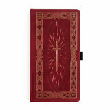 A bold, medieval-inspired notebook designed for adventurers at heart—perfect for journaling, planning, or capturing your next great story. Featuring a rich crimson vegan leather cover with intricate gold-foil detailing and a radiant sword centerpiece, this notebook feels like a treasured tome pulled from a castle library.