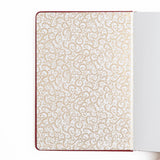 A bold, medieval-inspired notebook designed for adventurers at heart—perfect for journaling, planning, or capturing your next great story. Featuring a rich crimson vegan leather cover with intricate gold-foil detailing and a radiant sword centerpiece, this notebook feels like a treasured tome pulled from a castle library.