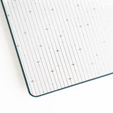 Quiet, expansive, and full of wonder — the Meteor Shower Notebook captures the magic of watching the night sky come alive. A deep, moody cover is scattered with delicate shooting stars, creating a sense of calm movement and cosmic possibility. It’s a notebook made for late-night thoughts, creative sparks, and ideas that arrive like falling stars.
