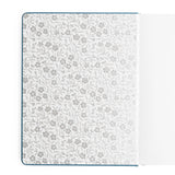 Wild Periwinkle Notebook

Let your creativity unfurl like a field of wildflowers. The Wild Periwinkle Notebook pairs soft blue tones with delicate white florals, creating a peaceful place to gather your thoughts, start new projects, and savor quiet moments of reflection. It’s a beautifully timeless companion for journaling, planning, or everyday inspiration.