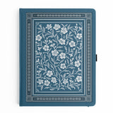 Wild Periwinkle Notebook

Let your creativity unfurl like a field of wildflowers. The Wild Periwinkle Notebook pairs soft blue tones with delicate white florals, creating a peaceful place to gather your thoughts, start new projects, and savor quiet moments of reflection. It’s a beautifully timeless companion for journaling, planning, or everyday inspiration.