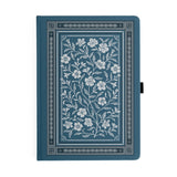 Wild Periwinkle Notebook

Let your creativity unfurl like a field of wildflowers. The Wild Periwinkle Notebook pairs soft blue tones with delicate white florals, creating a peaceful place to gather your thoughts, start new projects, and savor quiet moments of reflection. It’s a beautifully timeless companion for journaling, planning, or everyday inspiration.