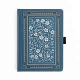 Wild Periwinkle Notebook

Let your creativity unfurl like a field of wildflowers. The Wild Periwinkle Notebook pairs soft blue tones with delicate white florals, creating a peaceful place to gather your thoughts, start new projects, and savor quiet moments of reflection. It’s a beautifully timeless companion for journaling, planning, or everyday inspiration.