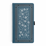 Wild Periwinkle Notebook

Let your creativity unfurl like a field of wildflowers. The Wild Periwinkle Notebook pairs soft blue tones with delicate white florals, creating a peaceful place to gather your thoughts, start new projects, and savor quiet moments of reflection. It’s a beautifully timeless companion for journaling, planning, or everyday inspiration.