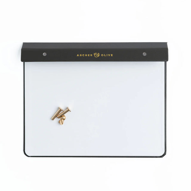 Create your own Notepad with our Notepad Backing + Screws + Box Set. Designed to securely hold your notepad pages with a luxurious finish.

Each set includes:

A sturdy cardboard and vegan leather backing, finished with a gold foiled Archer and Olive logo.
Size: A5
2 gold metal binding screws to secure any Archer and Olive Notepad Refill to the backing.
Durable outer box to store your completed notepad once you create it.
This backing system pairs perfectly with our notepad refills, allowing you to easily a