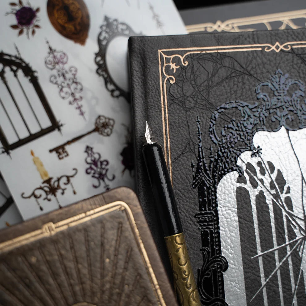 Unlock a world of haunting beauty with the Whispering Walls Halloween Box, an exclusive collection designed for journalers who adore gothic elegance and vintage mystery.