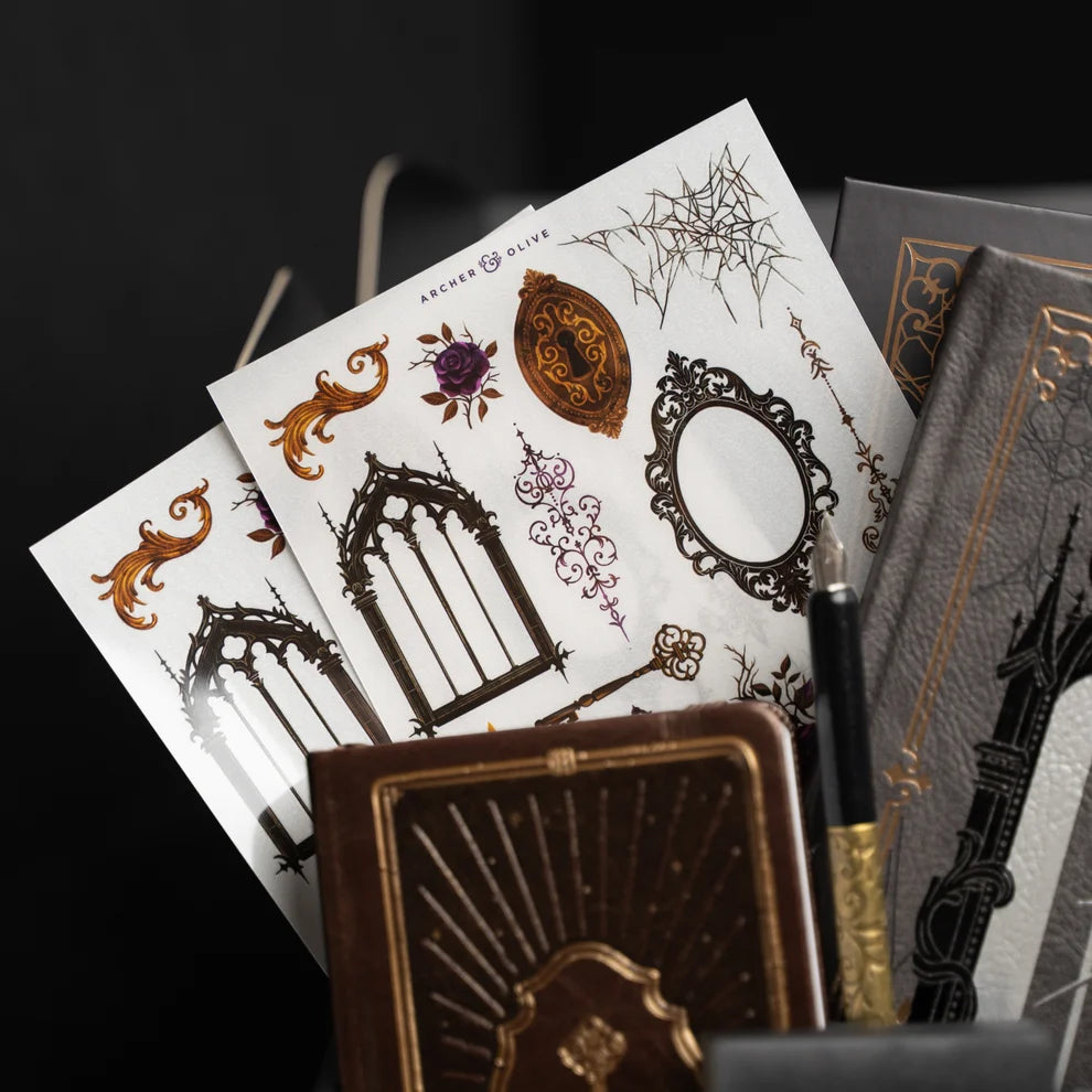 Unlock a world of haunting beauty with the Whispering Walls Halloween Box, an exclusive collection designed for journalers who adore gothic elegance and vintage mystery.