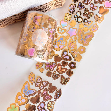 Add endless charm to your creative projects with this Large Sticker Roll — a journaling essential designed for versatility and fun!

Measuring 70mm wide and 5 meters long, each roll is packed with beautifully illustrated stickers printed on a frosted clear matte material that blends seamlessly into any spread, planner, or scrapbook page.

Whether you’re highlighting daily moments, decorating your bullet journal, or personalizing penpal letters, these rolls offer both variety and volume. Each design features