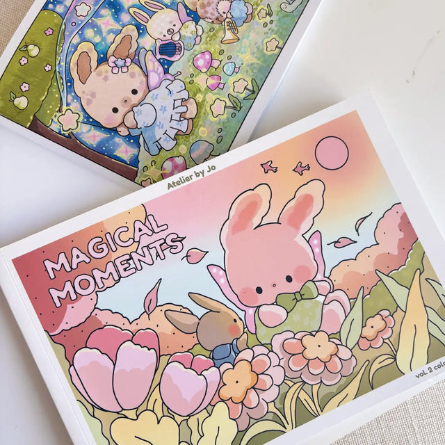🌿✨ Wander into Whimsy with Magical Moments Coloring Book Vol. 2! ✨🌿

Step into an enchanted world where forest paths lead to secret hideaways and a little magic lingers in the air. Featuring 25 original, full-page illustrations, this collection invites you join Cotton and Pluto on their adventures into cozy woodland cottages, sparkling streams, and whimsical escapes hidden deep in the forests

Whether you're curling up on a quiet afternoon or seeking a mindful creative escape, these charming, nature-inspi
