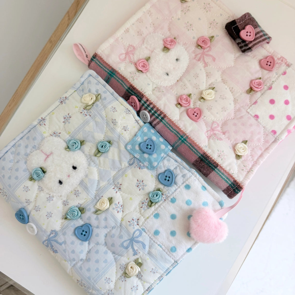 Elevate your journaling experience with these soft and cozy journal covers, designed to protect and personalize your daily diary. Each cover features beautiful blue and pink patterned fabric with thoughtfully sewn details and a secure metal button clasp to keep your pages safe. Includes matching ribbon bookmarks for easy navigation. Available in both A5 and A6 sizes to fit your preferred journal dimensions. The perfect companion for your daily routine and creative practice.